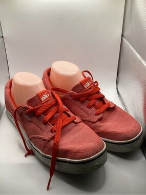 Nike 6.0 skate shoes featuring a vibrant red canvas upper and a speckled midsole